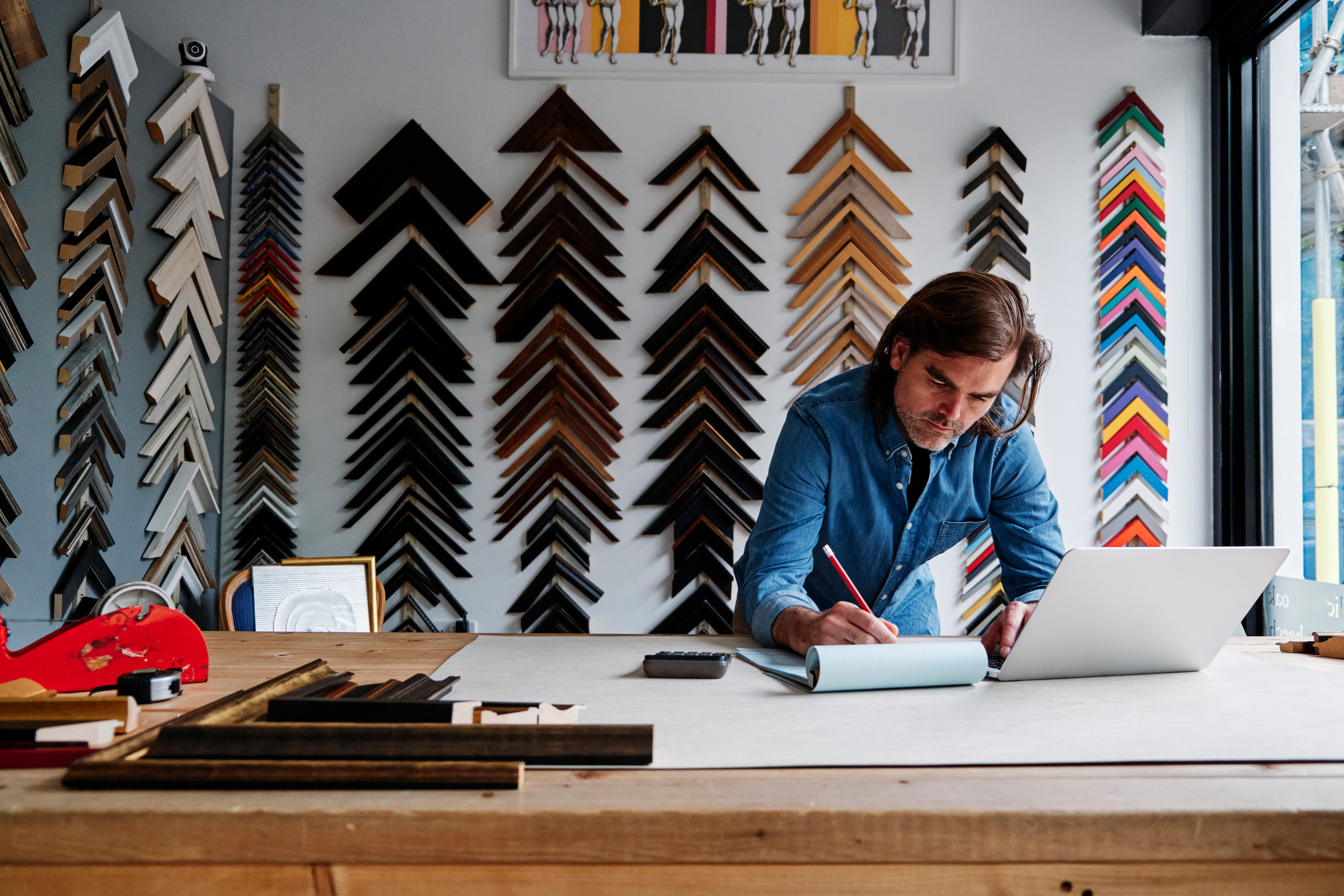 Man working in frame shop